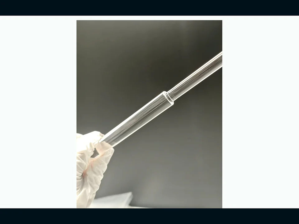Representative WONIK precision quartz tube and handling component — side view